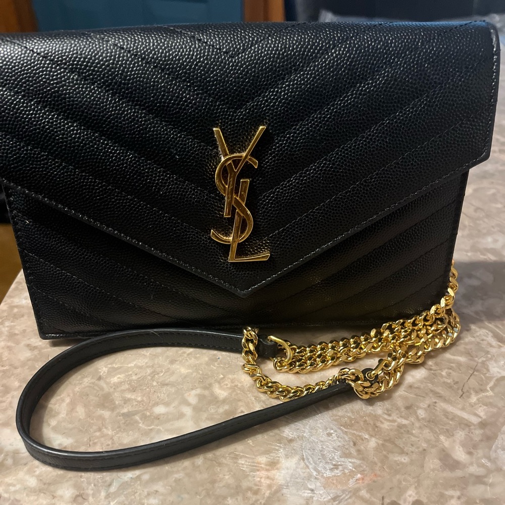 Gently used Black YSL bag with gold hardware